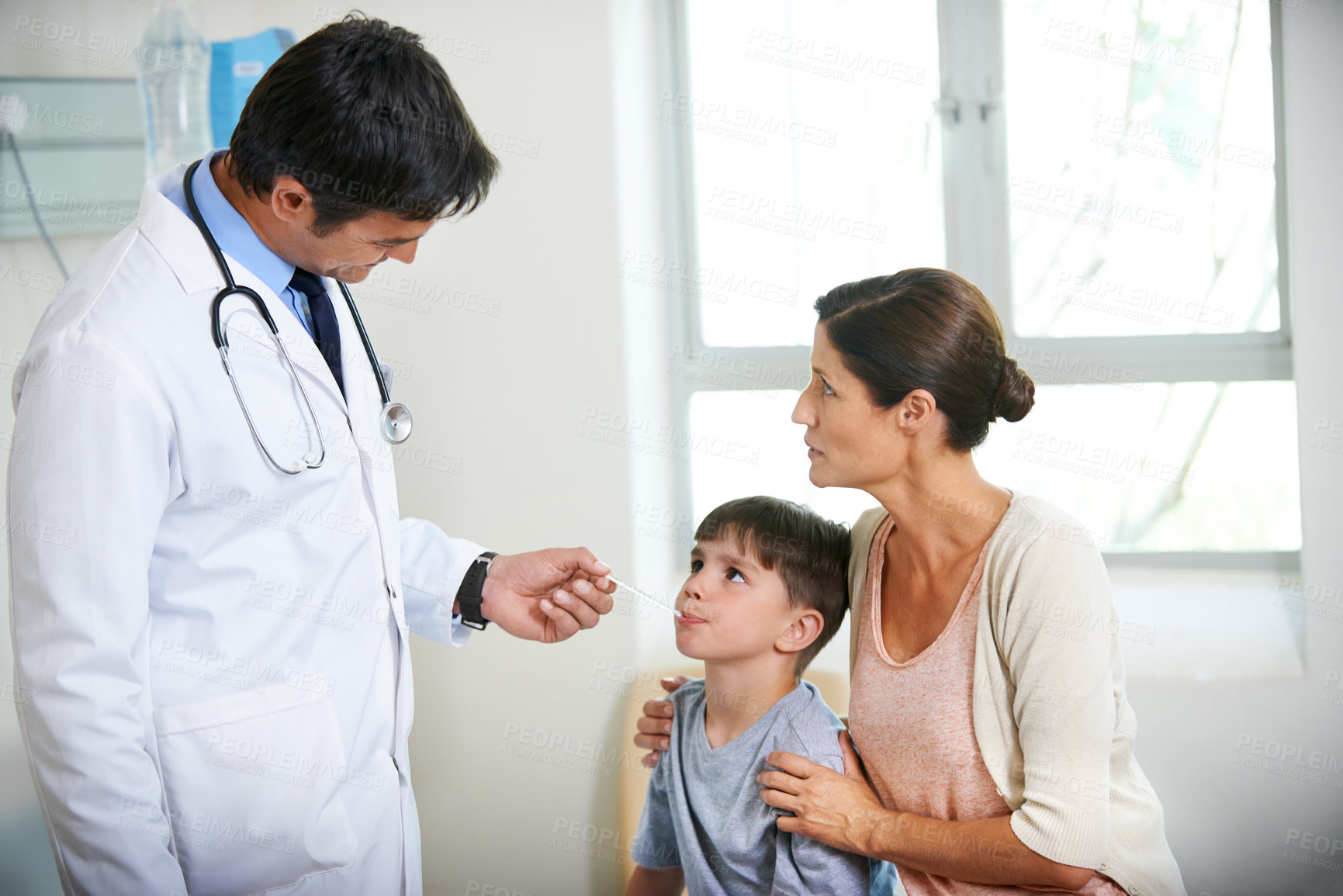 Buy stock photo Mother, child and doctor with thermometer in hospital for consulting, check fever and monitor temperature. Family, pediatrician and patient for assessment, virus risk or diagnosis of health treatment