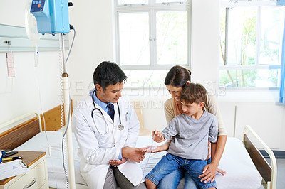 Buy stock photo Healthcare, iv drip or smile with doctor and family in hospital together for appointment, checkup or vaccine. Consulting, fluid or medical with woman, son and pediatrician in wellness clinic