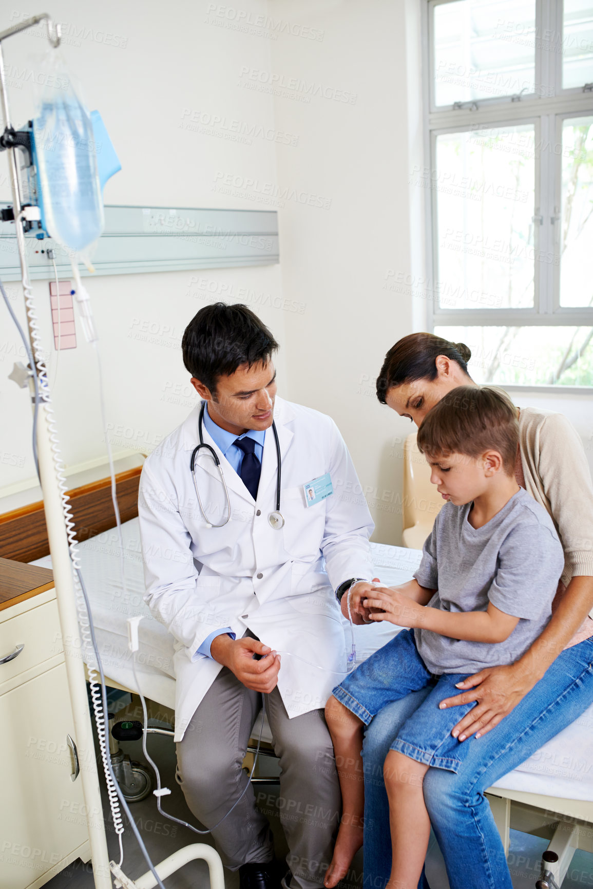 Buy stock photo Healthcare, iv drip or question with doctor and family in hospital together for appointment, checkup or vaccine. Consulting, medical or solution with mother, son and pediatrician in wellness clinic