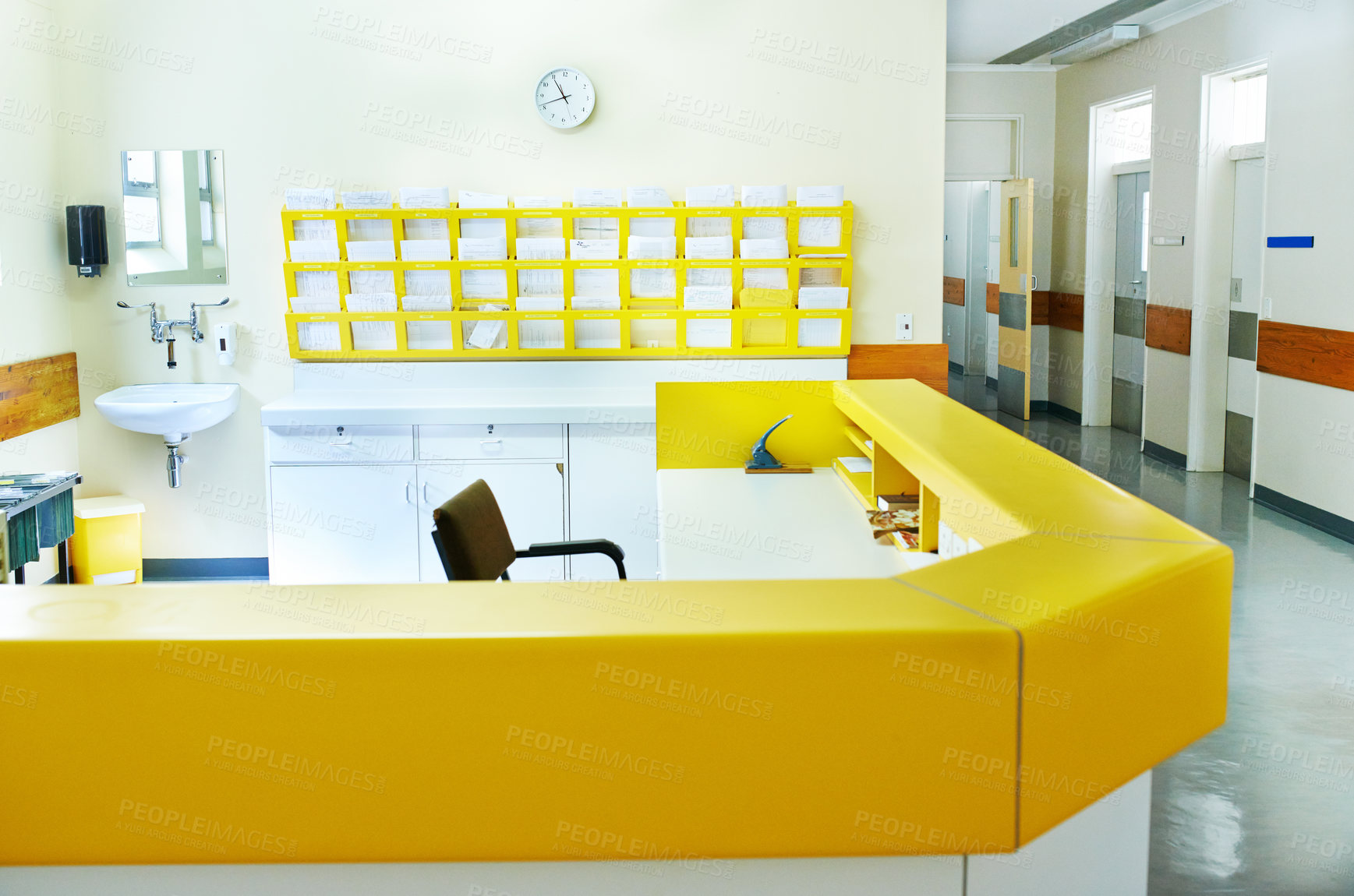 Buy stock photo Interior shot of a hospital nurse's station