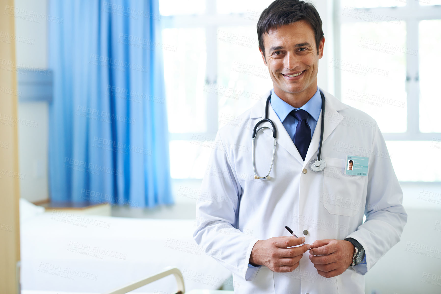 Buy stock photo Portrait, doctor and man with smile, hospital and happy for first day of employee, proud and expert. Clinic, medical professional and confidence of person, healthcare and lab coat for service