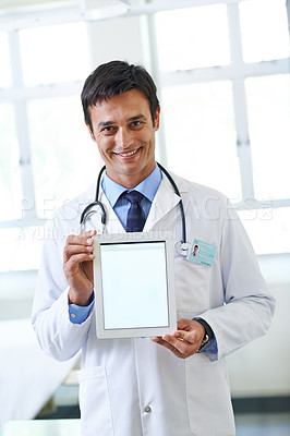 Buy stock photo Portrait, doctor and man with smile, tablet and show of screen in hospital, proud and display. Clinic, medical professional and confidence of person, healthcare and lab coat for employee and expert