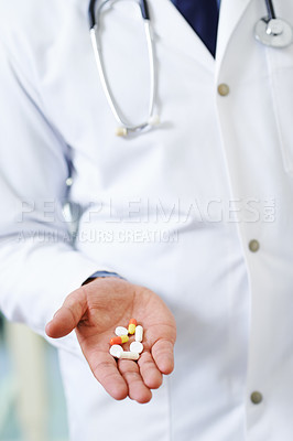 Buy stock photo Closeup of a doctor's hand holding different types of medication
