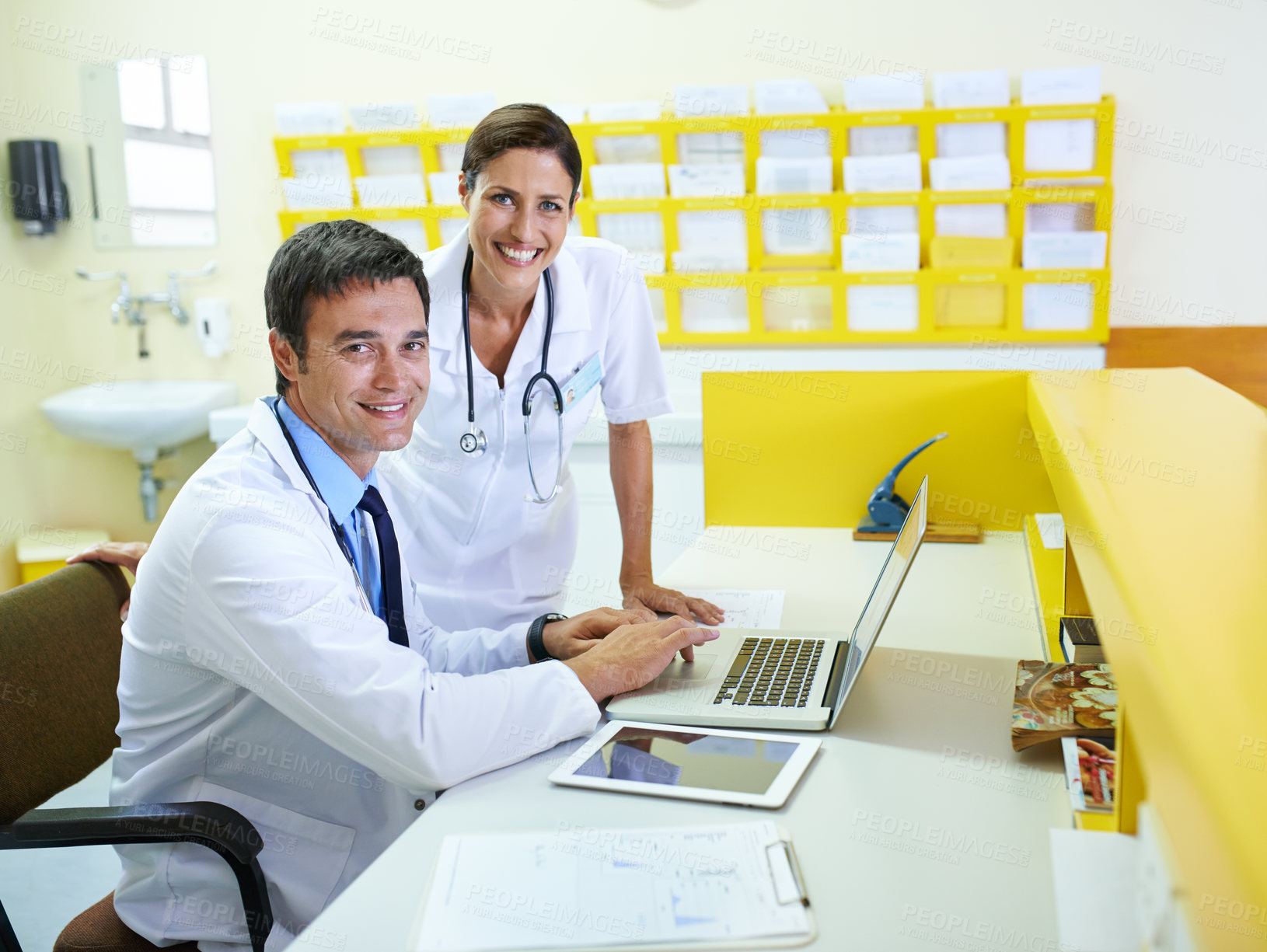 Buy stock photo Doctor, nurse and front desk portrait on laptop, discussion and planning for patient schedule in clinic. Medical, healthcare service and people together, teamwork and email results in hospital
