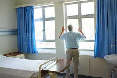 Buy stock photo Back, elderly man and hospital in depression, stress or lonely by window with medical aid debt for senior care. Male person, mental health and anxiety in clinic for cancer treatment, illness or grief