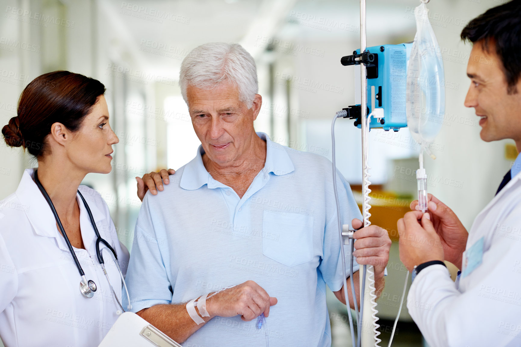 Buy stock photo Hospital, Iv drip and doctor with old man, nurse and elderly person with smile for medical appointment. Clinic, walking and nutrition for wellness, hydration and listen for healthcare and talking
