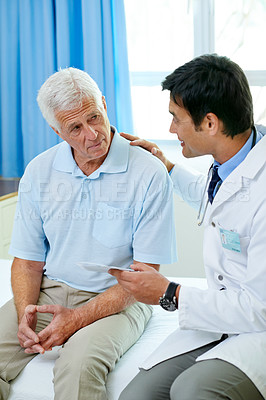Buy stock photo Consultation, doctor and old man in hospital room with advice, help and support from senior care clinic. Retirement, discussion on results and elderly patient sitting on bed with medical professional