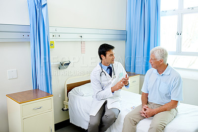 Buy stock photo Doctor, senior man patient and speaking with advice, explain or listen to news of health progress in clinic. Men, medic or consultation for wellness, healthcare or discussion in hospital and counting