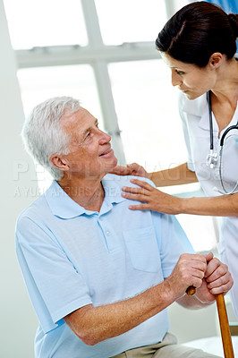 Buy stock photo Retirement, woman doctor and old man with cane in hospital, advice and help in support at senior care clinic. Nursing home, healthcare consultation and trust, person with disability on bed with nurse
