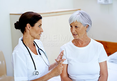 Buy stock photo Advice, female doctor and old woman in nursing home for results, help and support from senior care clinic. Retirement, discussion and medical feedback for elderly patient sitting on bed with nurse.