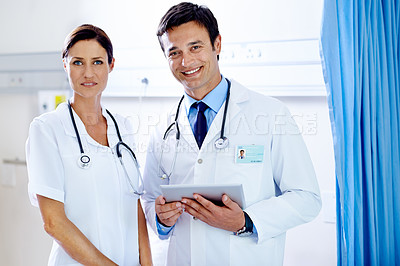 Buy stock photo Portrait of a handsome young doctor and his beautiful assistant