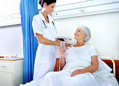 Buy stock photo Hospital room, care and nurse with old woman, glass and communication for health of patient and medical. Clinic, wellness and employee with senior person, water or smile  for hydration in appointment