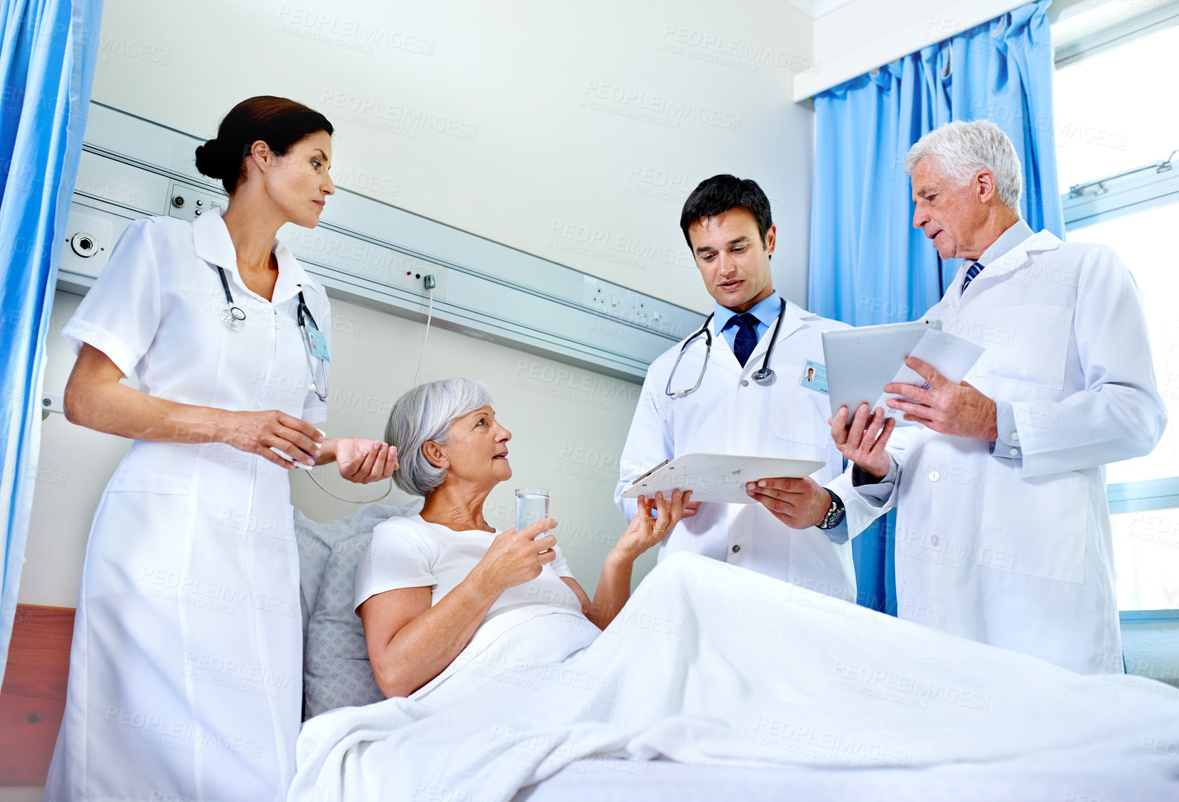 Buy stock photo Hospital, bed and doctors with old woman, explaining and communication for health of patient and medical. Clinic, wellness and nurse with senior person, water and document  with test in appointment