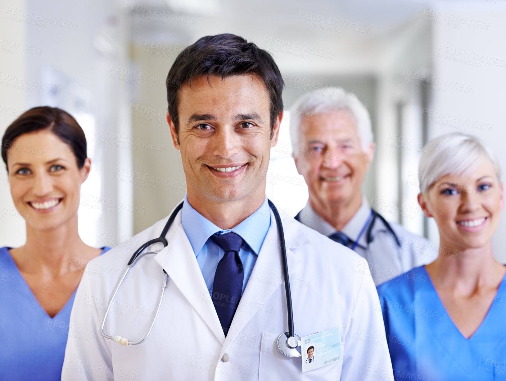 Buy stock photo Portrait, doctor and man with smile, group and happy for leadership in hospital, proud and expert. Clinic, medical professional and confidence of people, healthcare and lab coat for employees