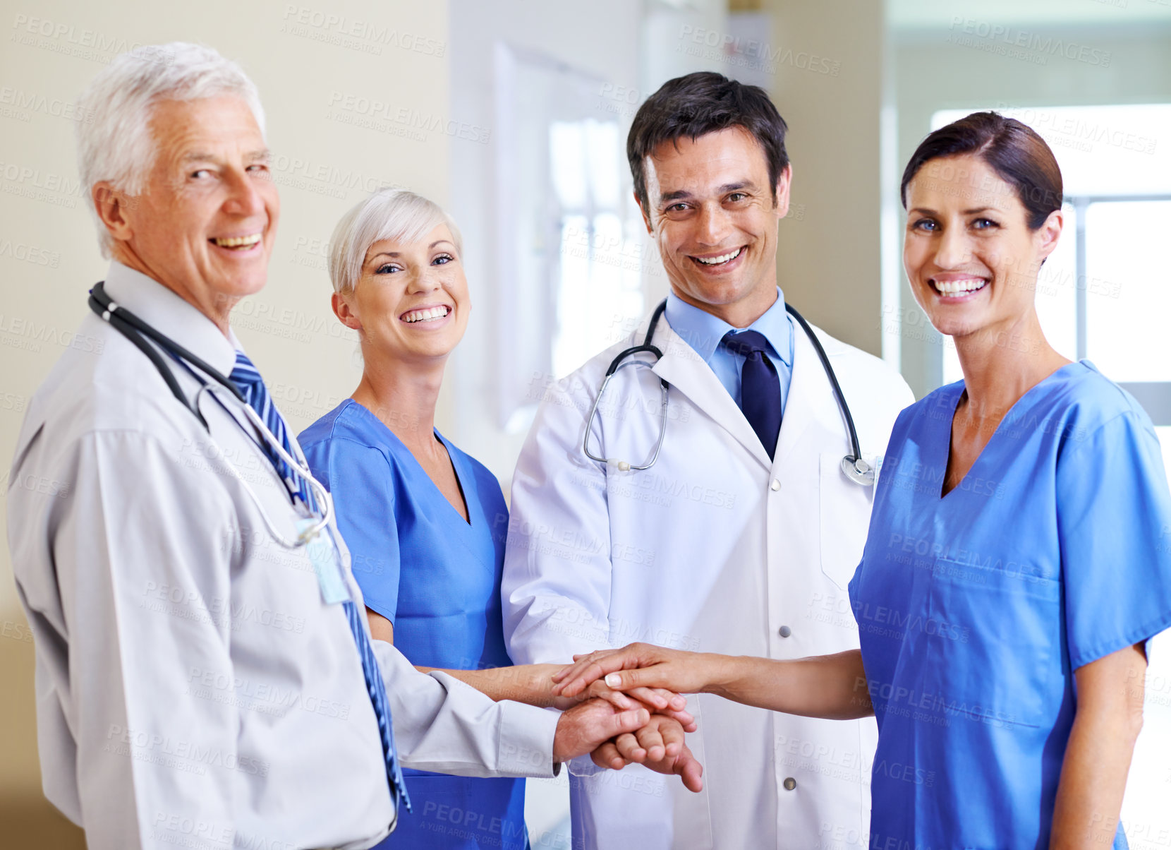 Buy stock photo Portrait, medical group and hand stack for healthcare collaboration, support and hospital community. Doctors, nurses and palm pile or huddle for motivation with team building, trust and staff goals