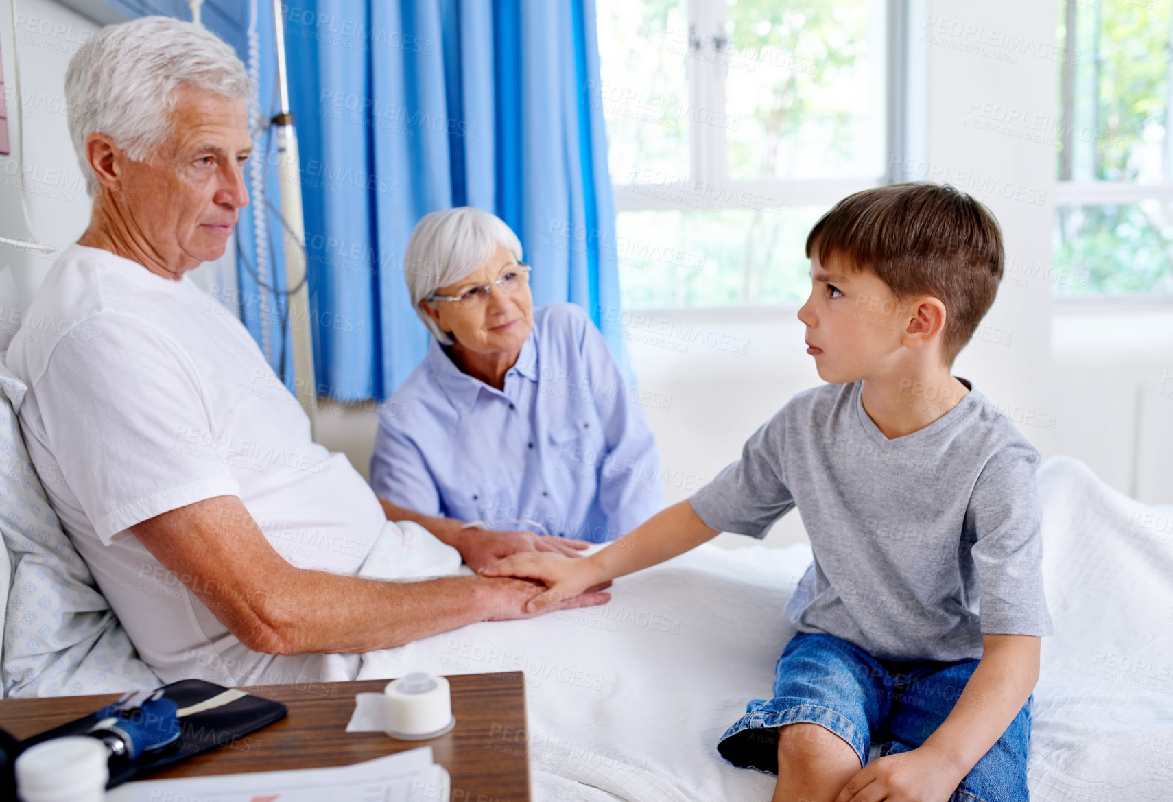 Buy stock photo Grandfather, kid and support in clinic bed for kindness, rehabilitation or medical healthcare with family. Grandpa, child and holding hands in hospital for comfort, care or empathy for sick patient.