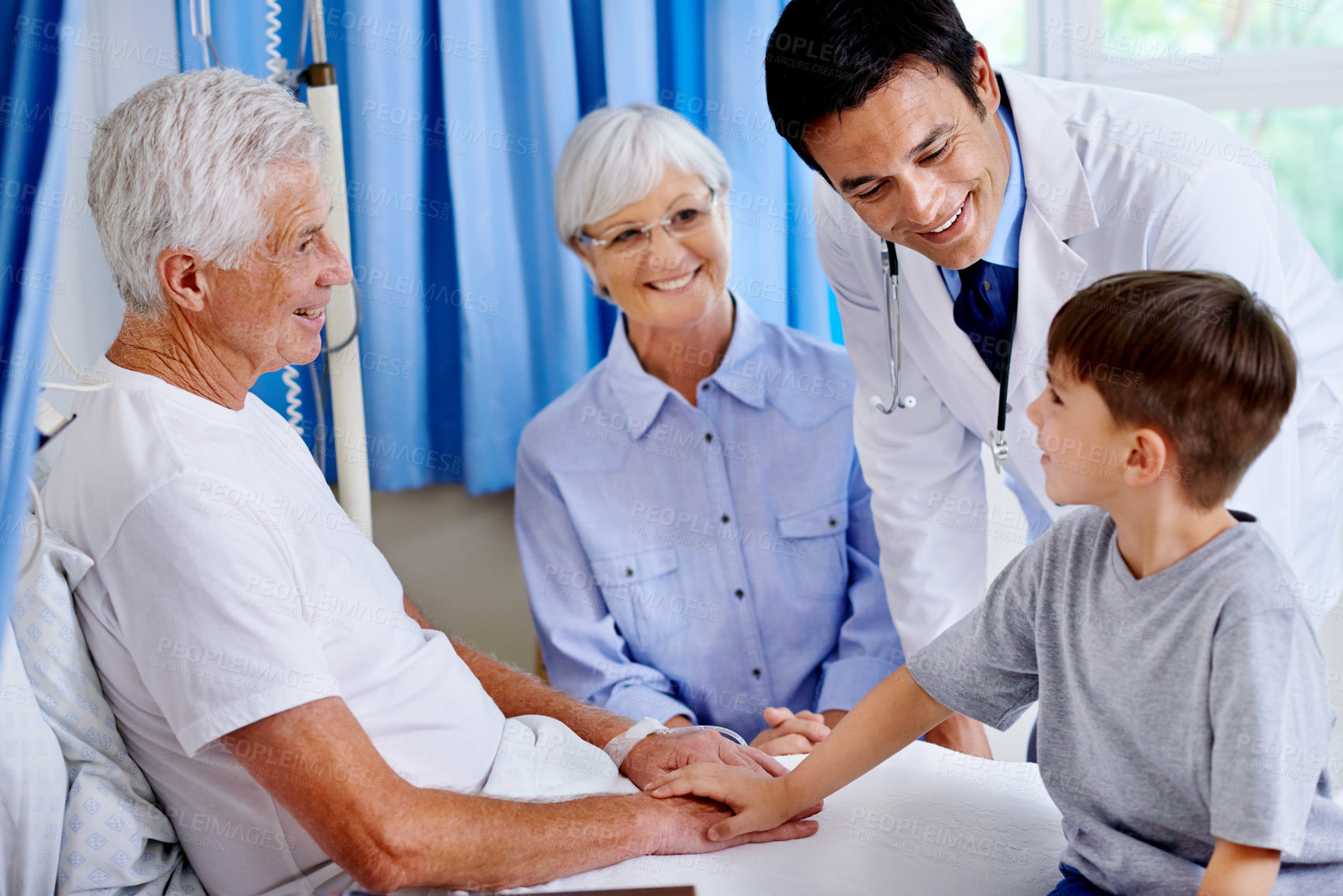 Buy stock photo Grandfather, child and support in clinic with doctor for healing, rehabilitation or medical healthcare with family. Grandpa, boy or holding hands for comfort, recovery or good news for happy patient