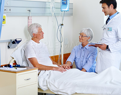 Buy stock photo Patient, doctor and woman on bed in hospital, medical professional and diagnosis with tablet for senior man. People, support and love for visiting or healthcare, hospitalized and illness treatment