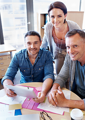 Buy stock photo Portrait of three coworkers in a meeting using a tablet