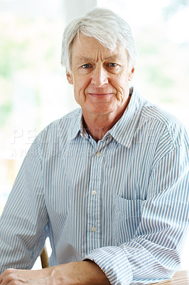 Buy stock photo Portrait of a senior man sitting indoors