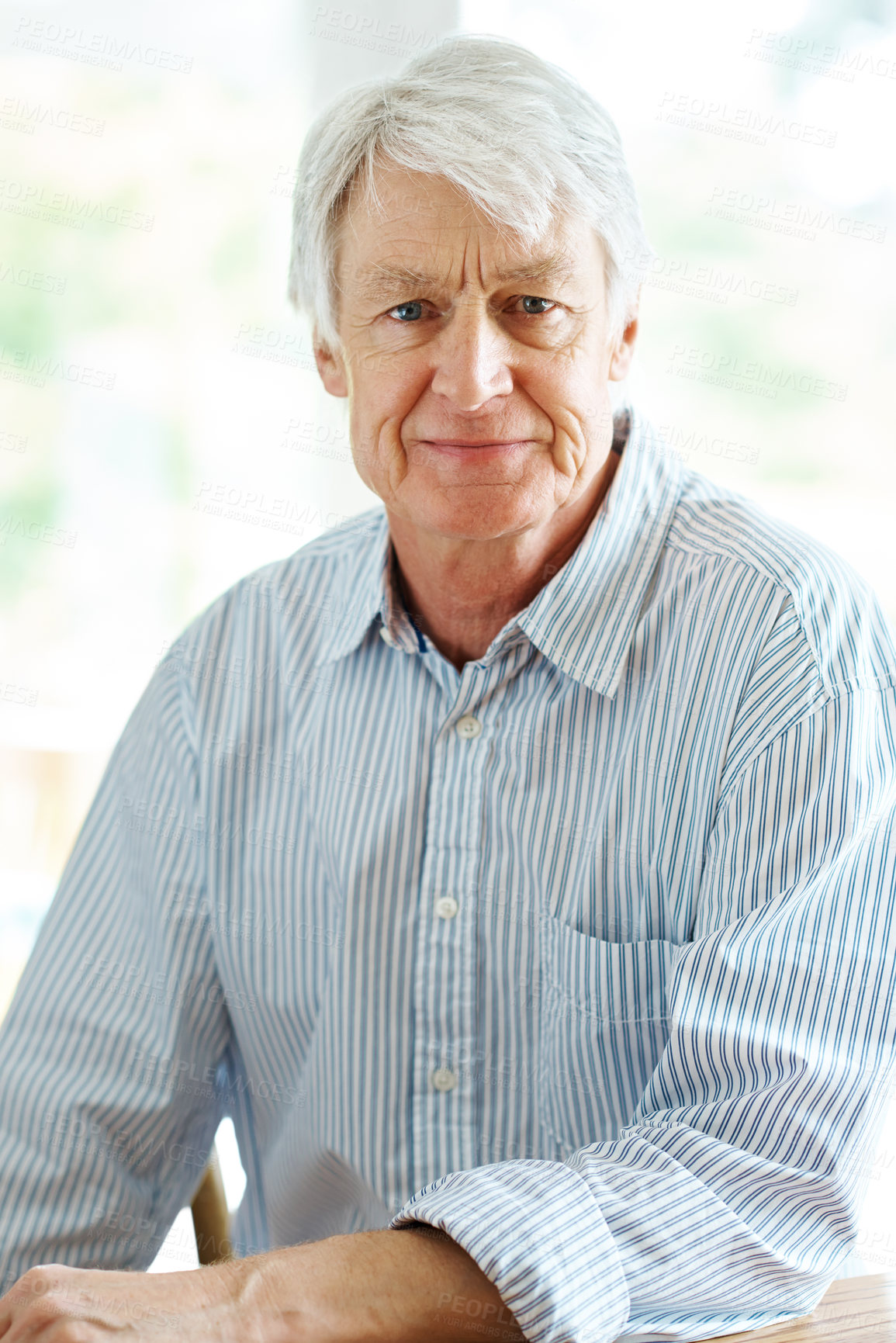 Buy stock photo Portrait of a senior man sitting indoors