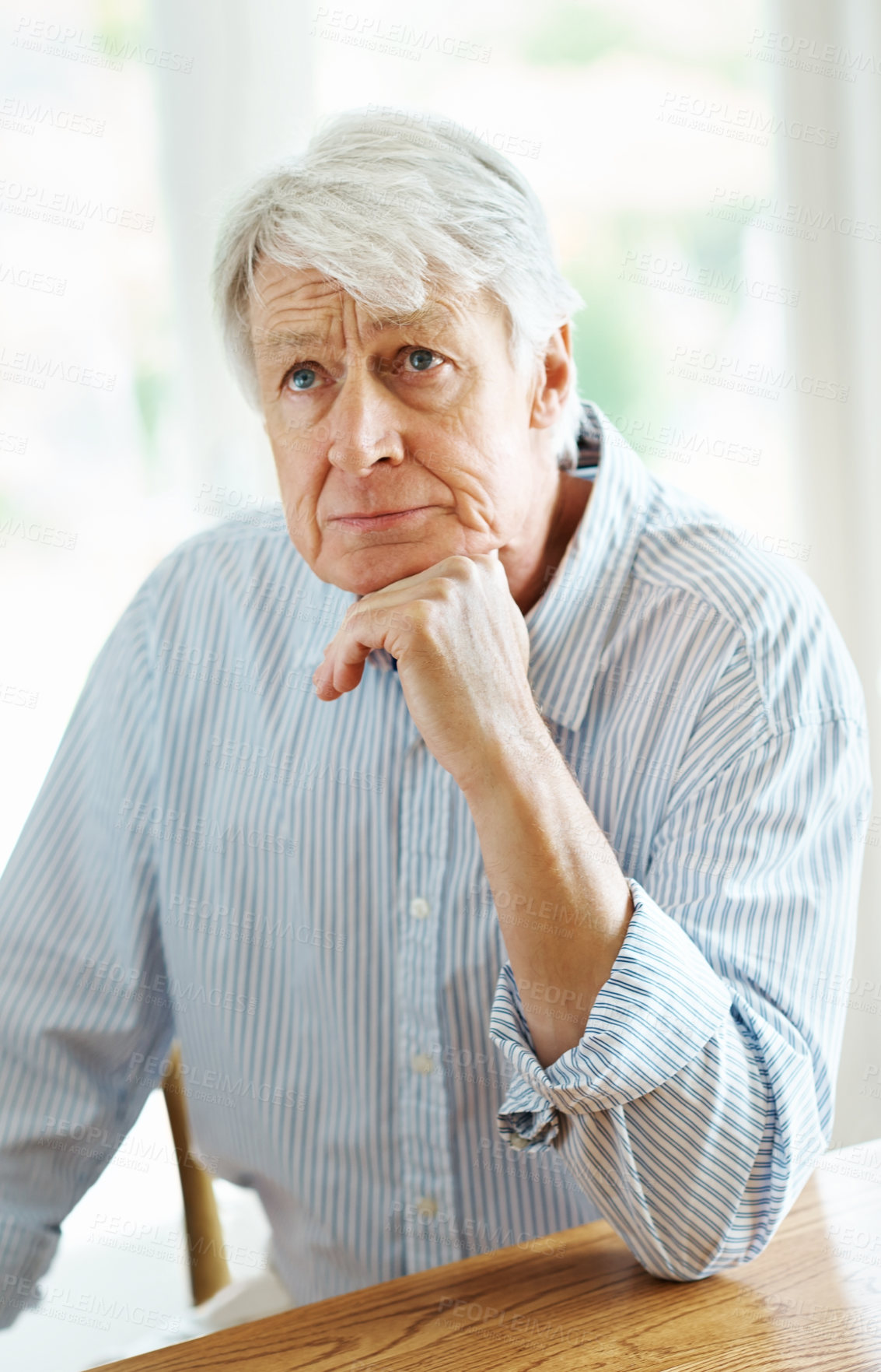 Buy stock photo Thinking, retirement and senior man in home with nostalgia, concerned and worry for future. Pensioner, frown and anxiety in living room for finances, question and reflection on memories in Canada