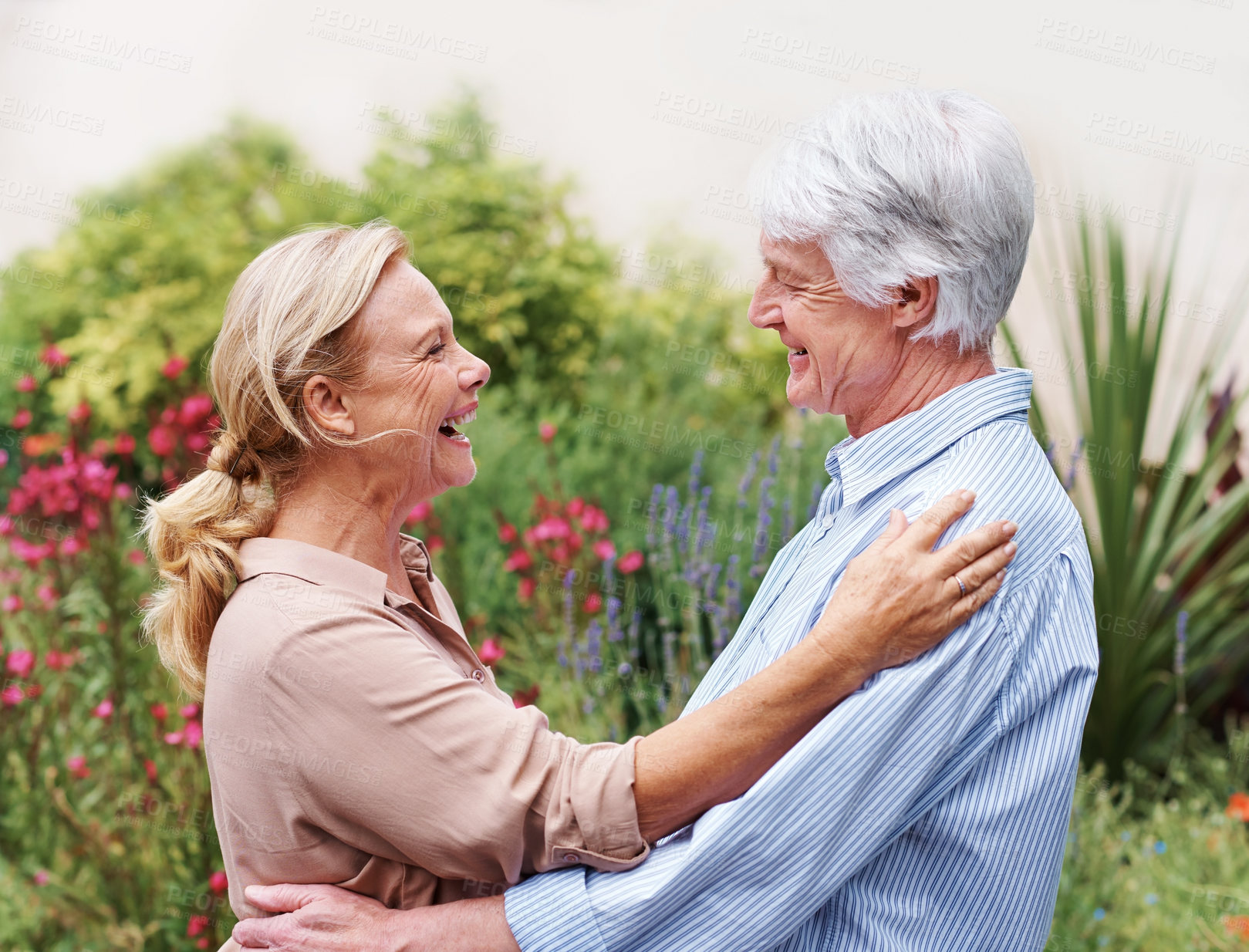 Buy stock photo Outdoor, hug and old couple with love, nature and happiness with retirement, smile and romance. Marriage, senior man and mature woman in garden, relationship and embrace for anniversary and funny