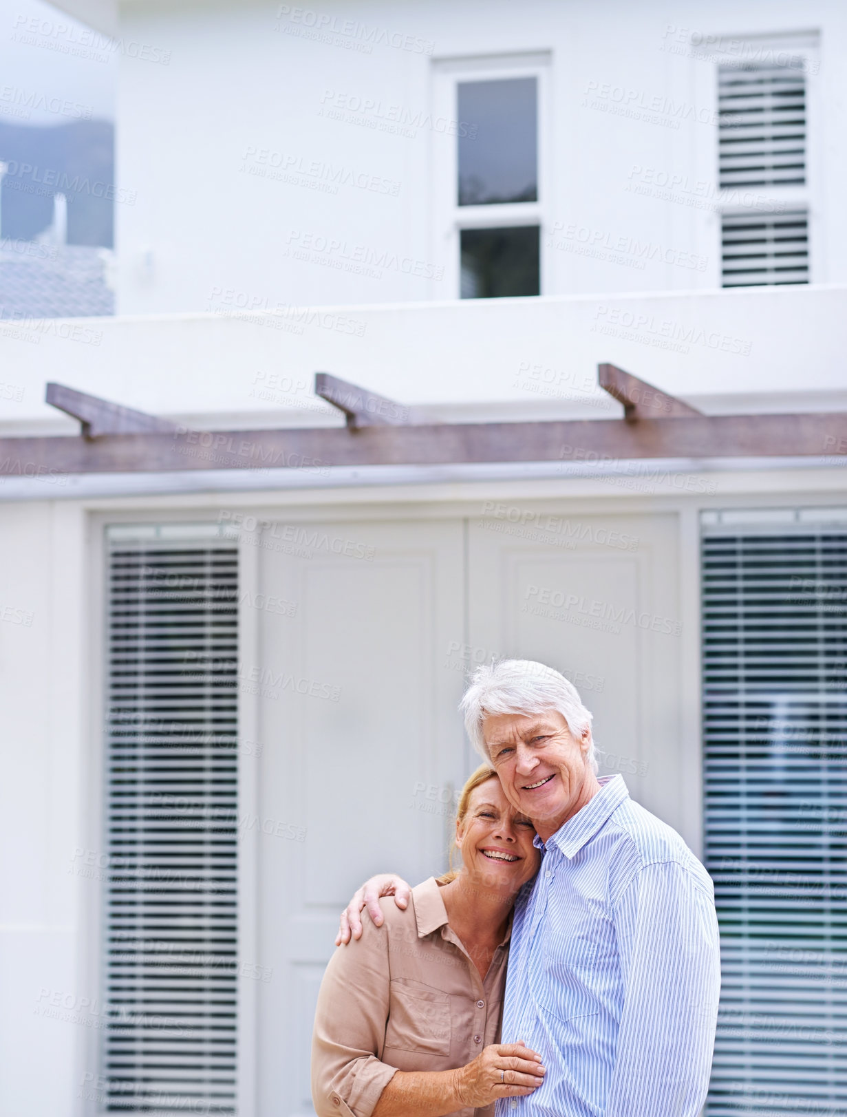 Buy stock photo Senior couple, portrait and new home outdoor for dream real estate investment, mortgage or loan. Face, happy man and woman hug for property sale, moving and relocation with homeowners in retirement