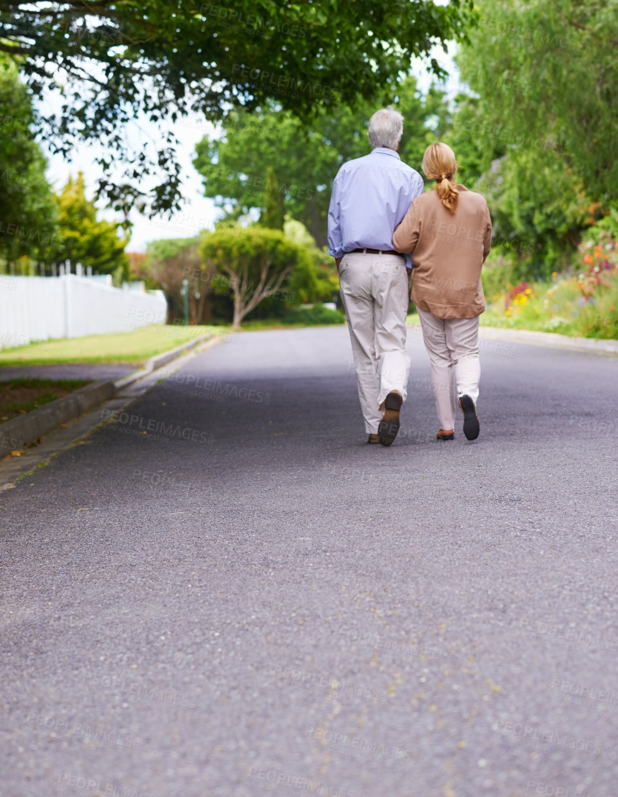 Buy stock photo Back, senior couple and walking in street as exercise for fitness, health and wellbeing in London. People, relationship and retirement as pensioner with bonding for love, care and support with trust 