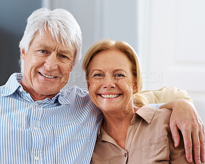 Buy stock photo Happy, hug and portrait of senior couple in home for love, support or smile together for care in lounge. Face, man and woman embrace for connection, loyalty or marriage with partner in retirement