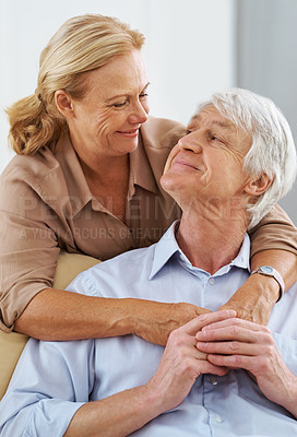 Buy stock photo People, mature couple and happy in home on sofa on retirement as pensioner for love in England. Love, relationship and smile with bonding for support, care and trust on break to relax on couch