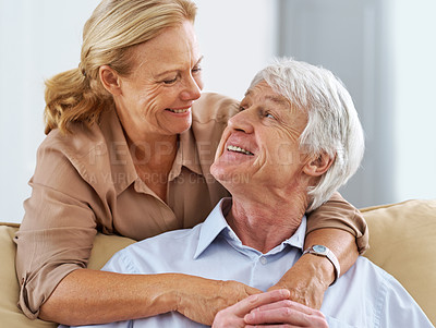 Buy stock photo Cropped shot of a senior couple looking at each other