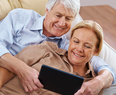 Buy stock photo Home, relax and old couple with tablet, internet or retirement with discussion, app and comfort. Apartment, senior man or mature woman with tech, network and digital communication with connection