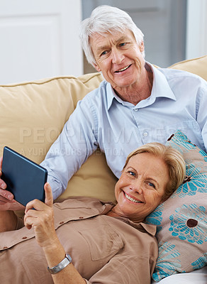 Buy stock photo Portrait, relax and tablet with senior couple on sofa in living room of home together for streaming. Internet, love or smile with elderly man and woman in apartment for retirement bonding or browsing