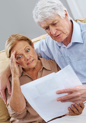 Buy stock photo Stress, senior couple and document at house for financial debt, mortgage crisis and account bankruptcy. Anxiety, elderly people and paperwork for retirement mistake, savings fail and bank collateral