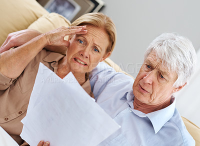 Buy stock photo Stress, elderly couple and document at house for financial debt, mortgage crisis and account bankruptcy. Anxiety, senior people and paperwork for retirement mistake, savings fail and bank collateral