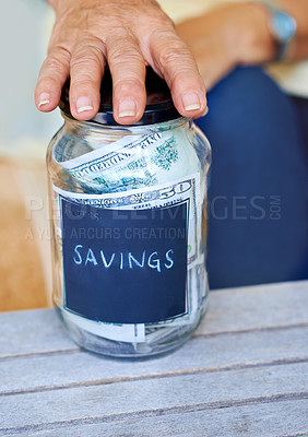 Buy stock photo Savings, money and hands or jar in home for finance or cash for investment and retirement. Security, paper and senior person in living room or lounge with budget, dollars and notes or goal for wealth