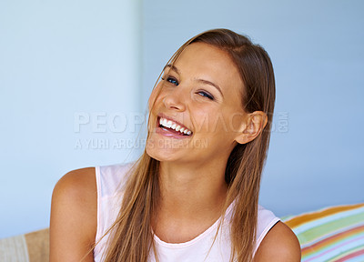 Buy stock photo Shot of a cheerful young woman enjoying herself