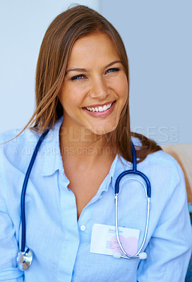 Buy stock photo Portrait, smile and stethoscope with nurse woman in home on blue background for assisted living. Face, healthcare and medicine with happy caregiver in apartment for medical, treatment or wellness