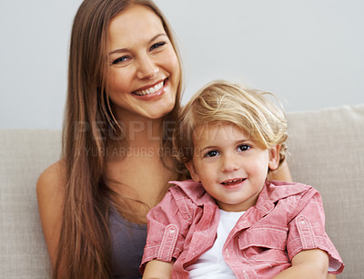 Buy stock photo Portrait of a happy single mother sitting with her son