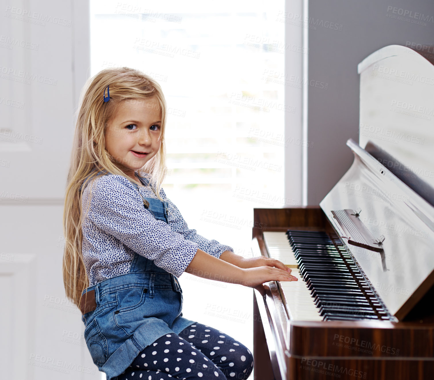 Buy stock photo Girl, portrait and playing piano in home, learning musical instrument and practice performance. Female person, child and classic keys for pianist skill, hobby and melody sound for talent development