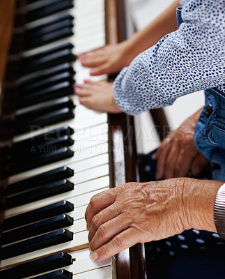 Buy stock photo Piano, hands and learning in home for music, development and practice with teaching closeup. Keyboard, creative and child or kid with teacher and instrument for sound, talent and audio for art