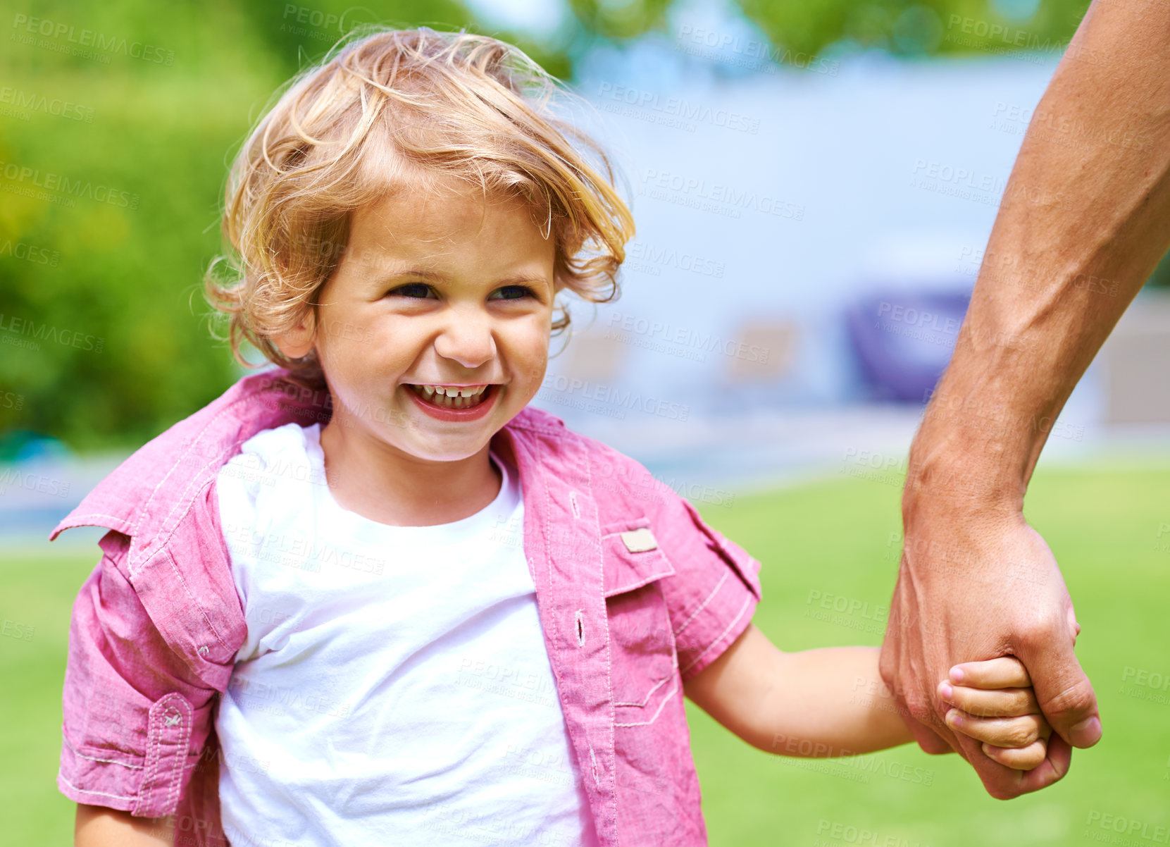 Buy stock photo Holding hands, single parent or child in garden for safety, love or bonding together for walking and care. Father, happy boy or guardian in nature for support or playing with smile, growth or kid