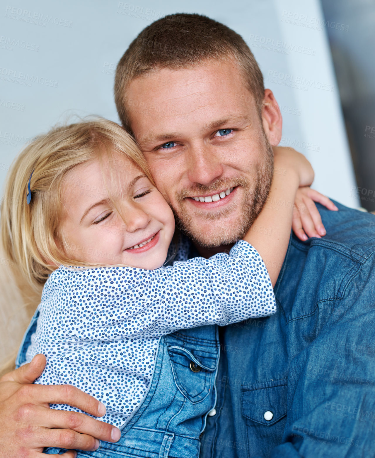 Buy stock photo Portrait of an adorable little girl hugging her father around the neck