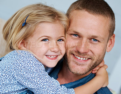 Buy stock photo Portrait of an adorable little girl hugging her father around the neck