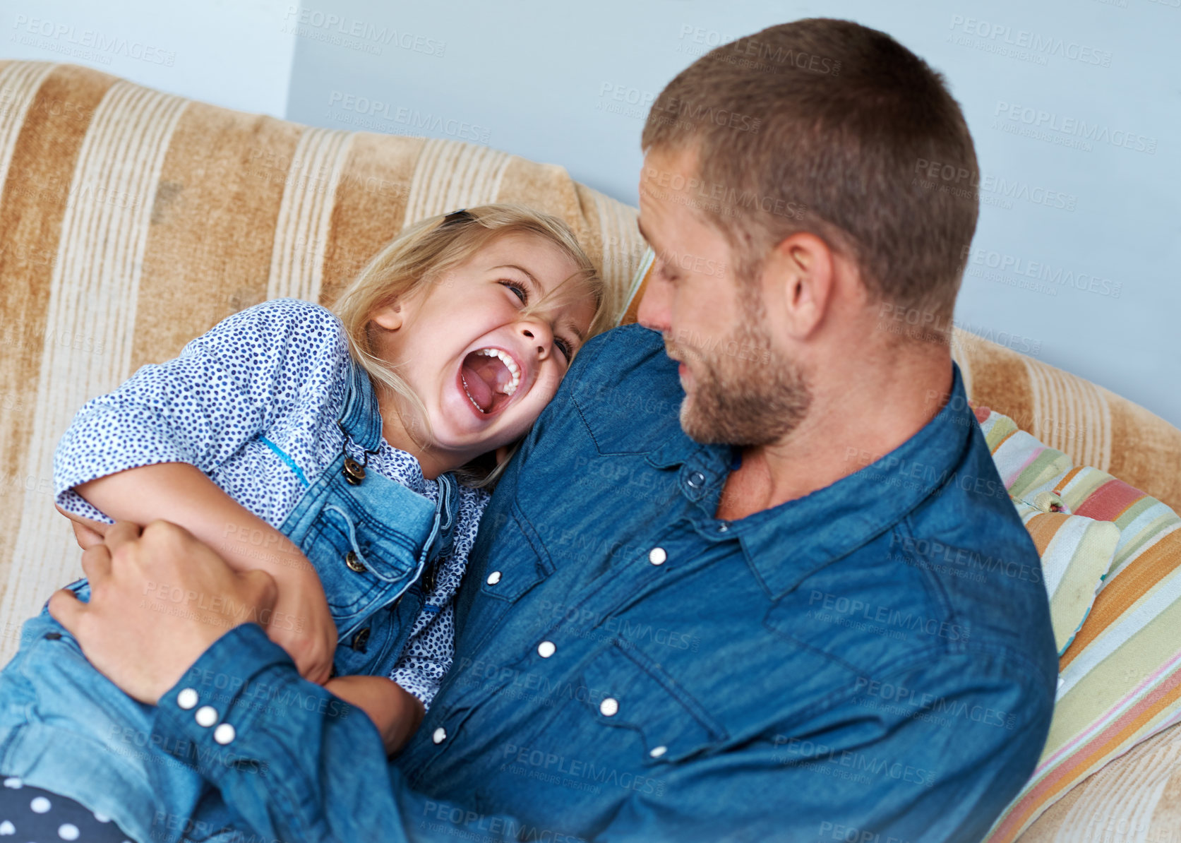 Buy stock photo Couch, father or happy daughter laughing with joke, love or care to relax together with single parent or wellness. Tickle, face or dad in family home with support and smile with kid or funny girl