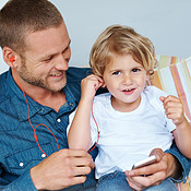 Dad Rocking Manger Rocking out with Dad | Buy Stock Photo on PeopleImages, Picture And ...
