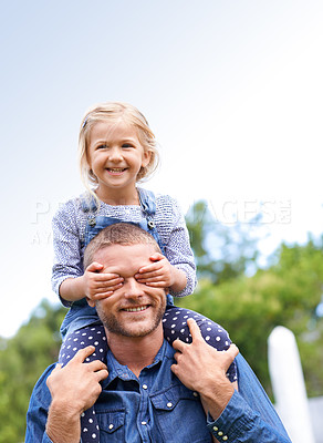 Buy stock photo Shot of a little girl on her daddy's shoulders covering his eyes with her hands