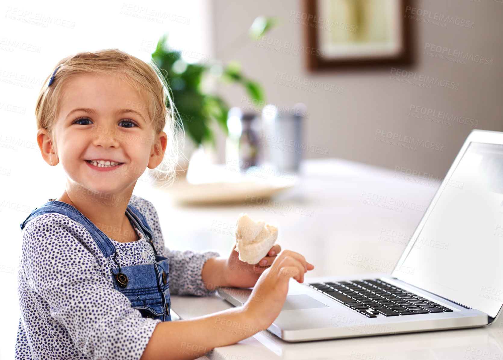 Buy stock photo Portrait, laptop and child in kitchen for education, online and internet for e learning at table. Kid, snack and happy for development in home and streaming, digital app or website for communication