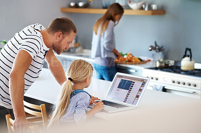 Buy stock photo Rearview of a dad helping his little girl out with the laptop